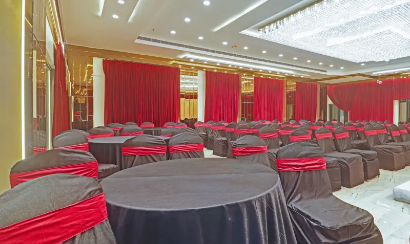 Banquet hall dressed with red and black chair covers